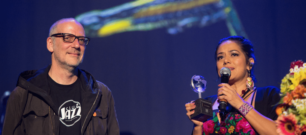 Laurent Saulnier, VP of Programming at FIJM handed the award to Lila Downs. Photo credit: Frédérique Ménard-Aubin. 2016