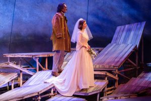 Jan Nyman (baritone John Moore) and Bess McNeill (soprano Kiera Duffy) prepare for their wedding day. Photo by Dominic M. Mercier for Opera Philadelphia.