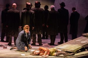 Dodo (mezzo-soprano Eve Gigliotti) looks on as Bess (soprano Kiera Duffy) sacrifices herself for Jan’s health. Photo by Dominic M. Mercier for Opera Philadelphia.