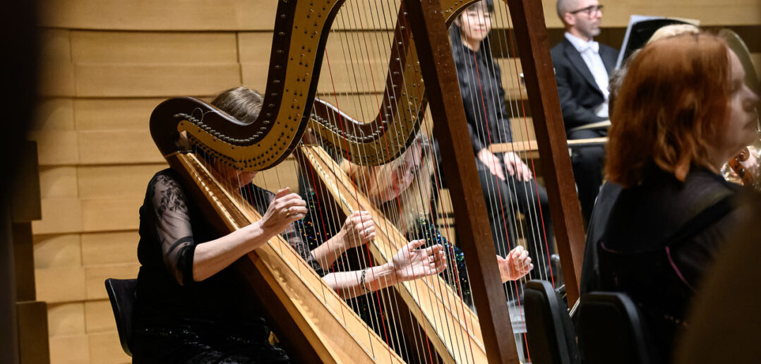 Close-up of Barbara Pazourová and Jana Boušková (harpists) with the Czech Philharmonic