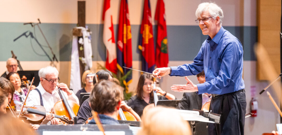 Ronald Royer conducting an orchestra