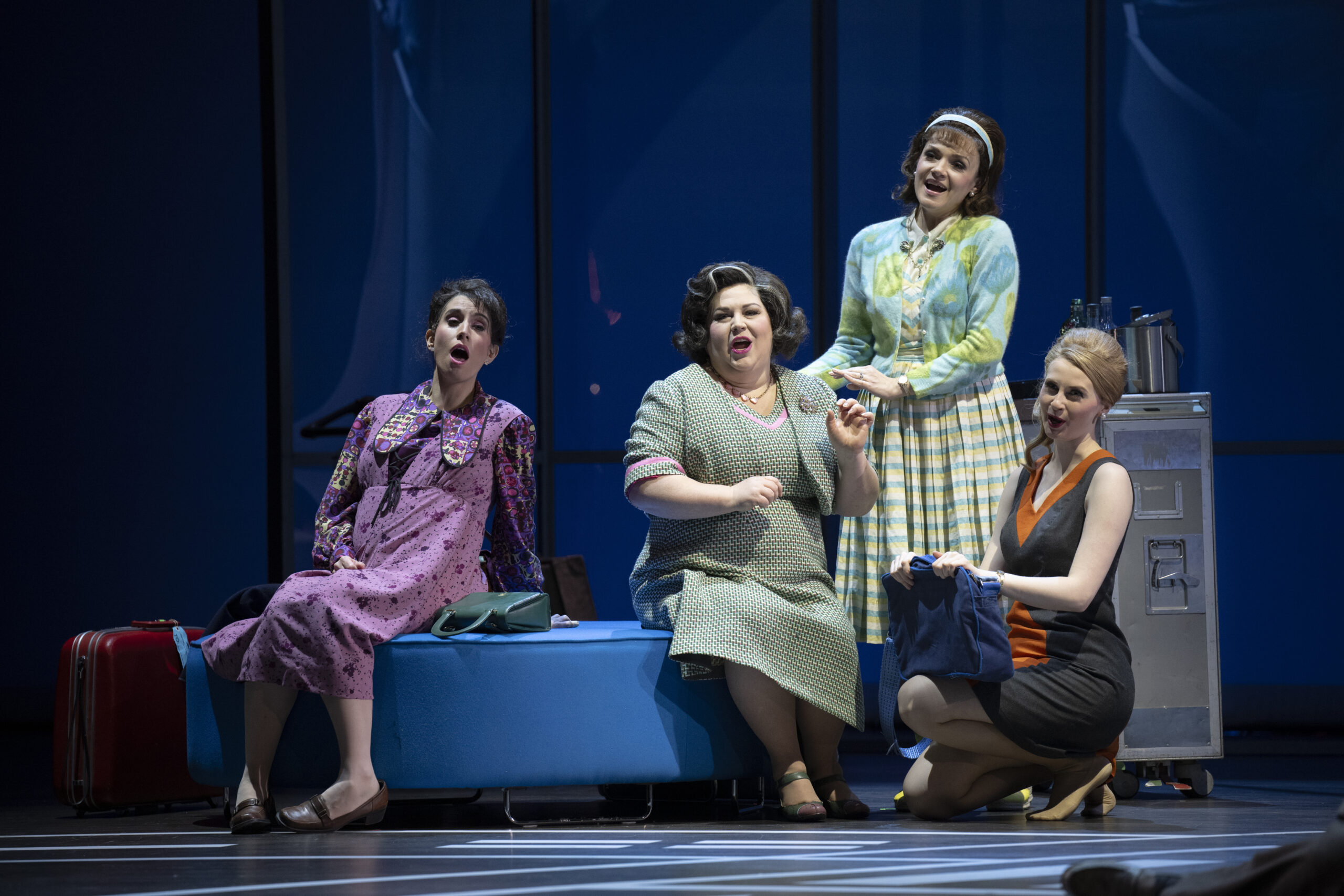 Stephanie Tritchew as the Minskwoman, Megan Latham as the Older Woman, Andriana Chuchman as Tina, and Alex Hetherington as the Stewardess in Vancouver Opera’s 2025 production of Flight