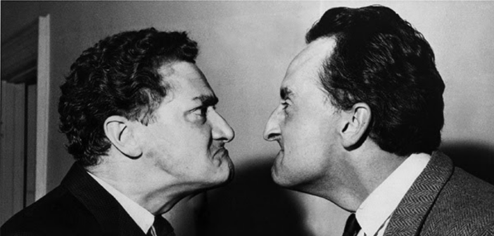 Black and white image of two men glaring at eachother