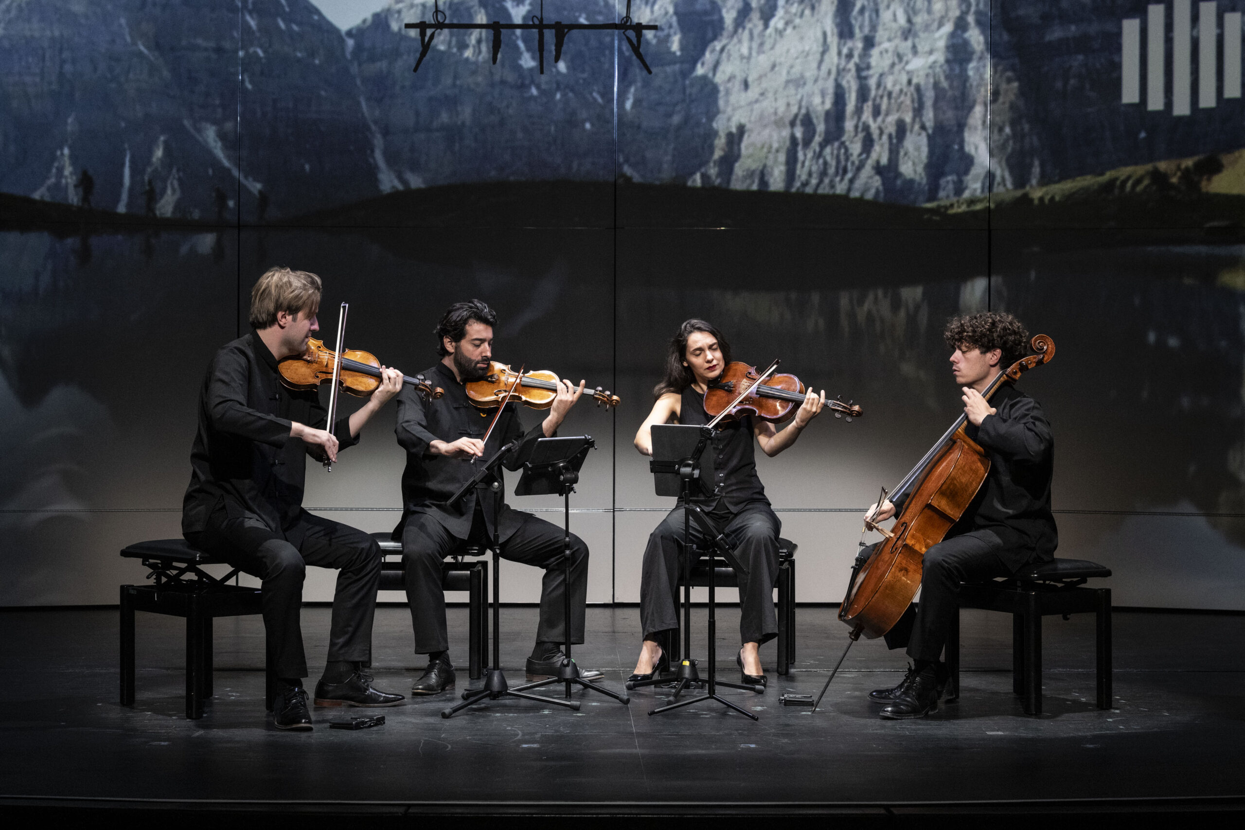 Quatuor Elmire on stage with mountain behind them at the Banff International String Quartet Competition (2025). 